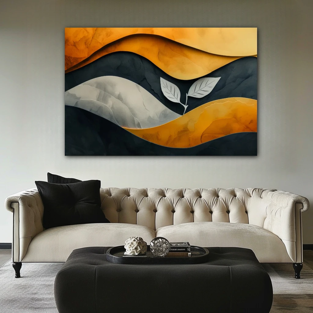 Cuadro resiliencia en momentos difíciles en formato horizontal con colores dorado, gris, naranja; decorando pared de encima del sofá